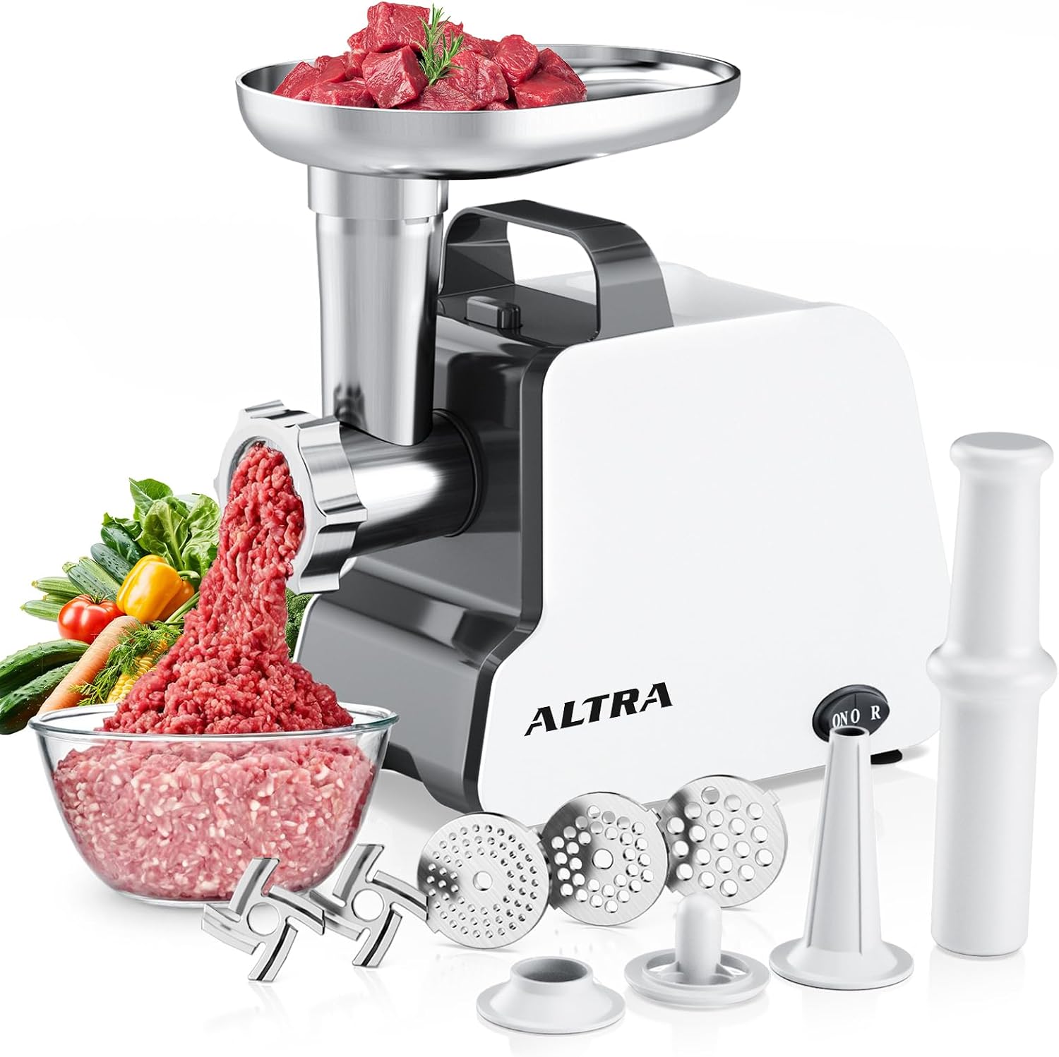 Altra Life 2300W Max electric meat grinder with a white body and black carry handle, ground beef falling into a glass bowl, with two blades, three grinding plates, a sausage tube, kubbe parts and the food pusher in front